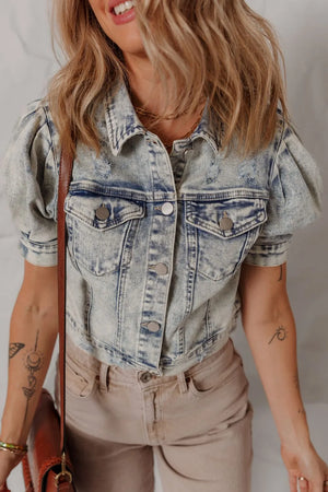 Cropped denim bolero jacket in medium wash with puff sleeves and distressed details.