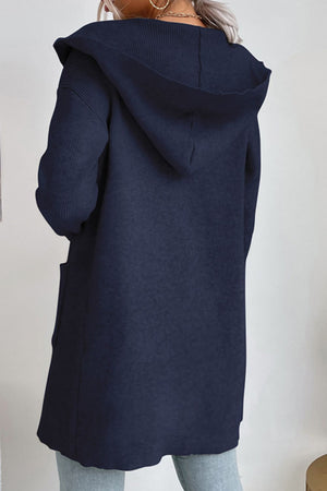 Navy ribbed knit hooded cardigan with pockets, shown from the back.