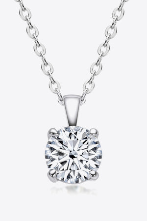 Silver chain necklace with a round brilliant cut solitaire diamond pendant.
