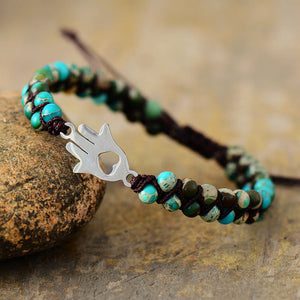 Turquoise bead bracelet with Hamsa hand charm and heart cutout, macrame cord detail