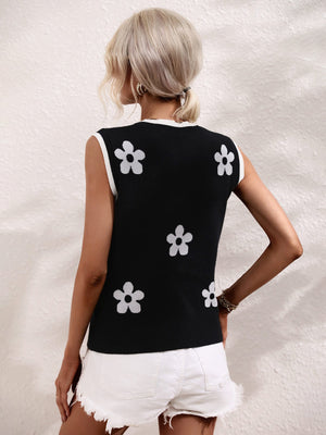 Black daisy motif knit tank top with white trim.