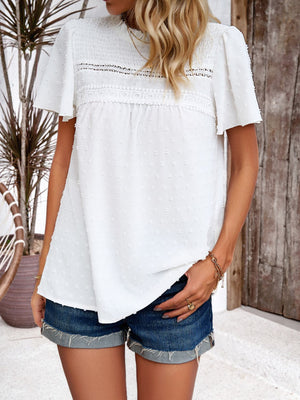 White dotted swiss smocked bodice flutter sleeve blouse with lace trim detail
