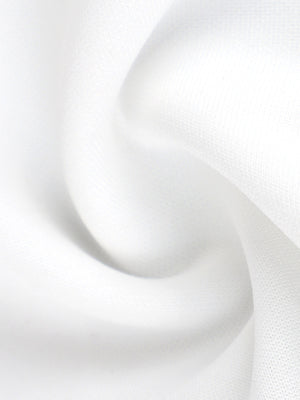 Elegant white mini dress fabric detail with soft ruffles.