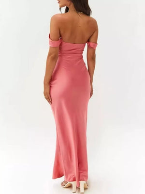 Coral satin off-shoulder maxi gown with draped neckline and bodycon fit.