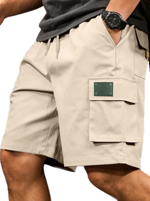 Apricot cargo shorts with drawstring waist and side pocket detail.