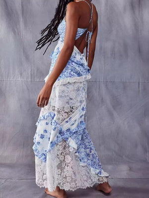 Blue floral lace maxi dress with asymmetrical ruffles and open back.
