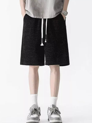 Men's black waffle-knit casual shorts with drawstring and pockets