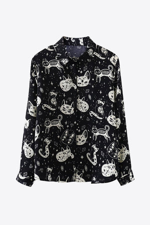 Black button-up blouse with a celestial cat print and long sleeves.