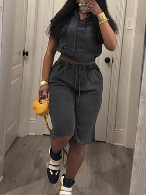 Black hooded sleeveless crop top and drawstring shorts set with a washed cotton look.