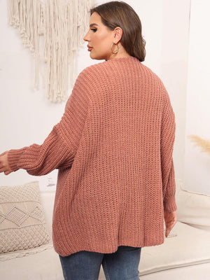 Chunky knit cardigan in coral with balloon sleeves and ribbed texture.