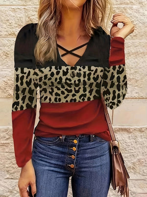Crisscross leopard block top in deep red, black, and animal print with long sleeves.