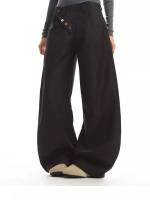 Black wide-leg chinos with a decorative button-fly closure and relaxed fit.