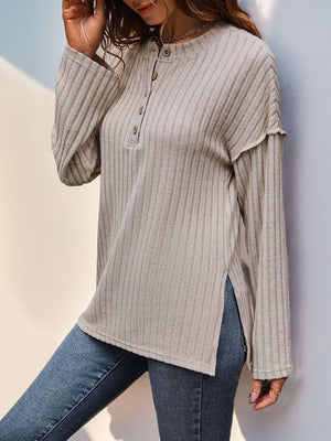 Tan textured henley shirt with button detail and flared sleeve.