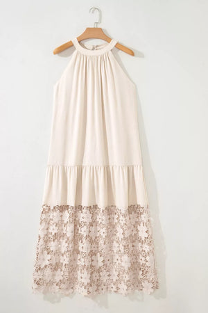 Beige halter maxi dress with tiered skirt and floral lace hem detail