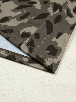 Sleek mock neck slim tee in camouflage print with double-stitched hem detail.