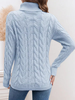 Sky blue cable-knit turtleneck sweater with ribbed cuffs and hem.