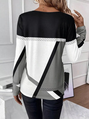 Long sleeve t-shirt with geometric color block pattern in black, white, and gray.