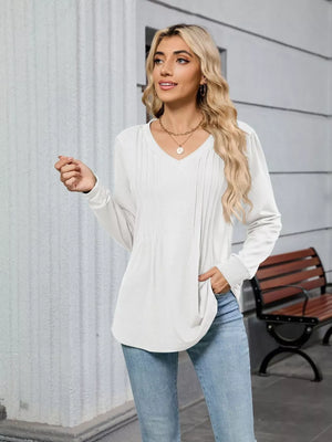 White V-neck long sleeve maternity t-shirt with subtle pintuck detail and relaxed fit.