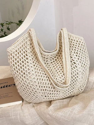 Rice white woven straw shoulder bag with open crochet pattern and braided straps.