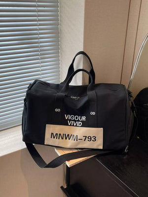 Black nylon travel bag with "Vigour Vivid" print and strap detail