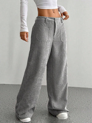 Gray corduroy wide-leg utility trousers with large front pockets and a relaxed fit.