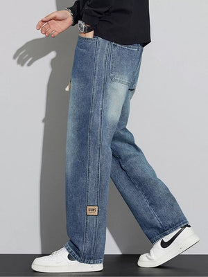 Men's wide-leg jeans in Nostalgic blue denim with a drawstring and patch detail.