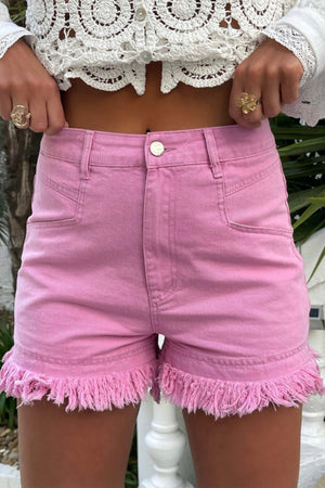 Pink high-rise denim shorts with a frayed hem and a casual fit.