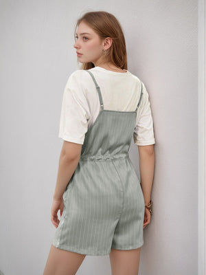 Sage pinstripe romper with adjustable waist, styled with a white t-shirt.