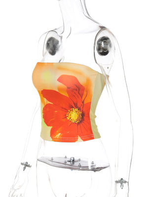 Floral print strapless tube top with a large orange flower on a light yellow and orange gradient background.