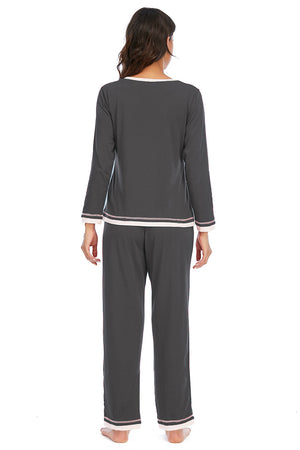 Charcoal long sleeve pajama set with contrast trim on neckline, cuffs, and hem.