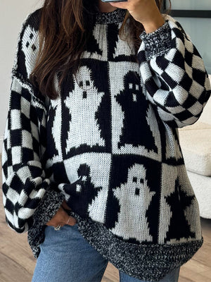 Black and white ghost checkered knit sweater with crew neck and long sleeves.