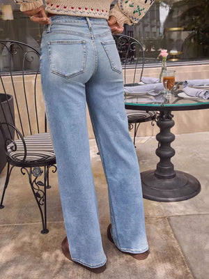 Light blue denim high-waisted wide-leg jeans with button closure.