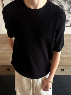 Men's black short sleeve knit top with crew neck.