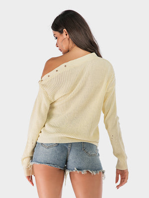 Beige knit sweater with button detail on shoulder, off-the-shoulder neckline, and long sleeves.
