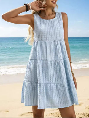 Sky blue tiered mini dress with vertical stripe texture, sleeveless, round neck.