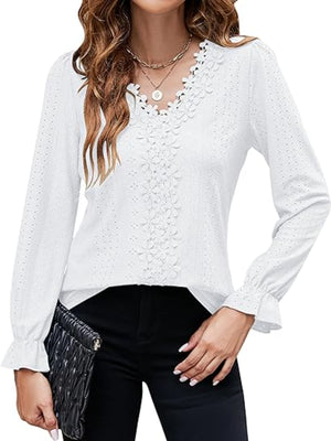 White eyelet blouse with floral embroidery and ruffle cuffs