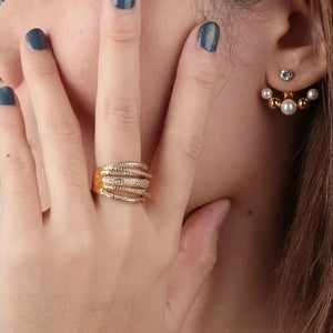 Gold-plated multi-row ring with detailed pave stones and a matching pearl ear jacket.