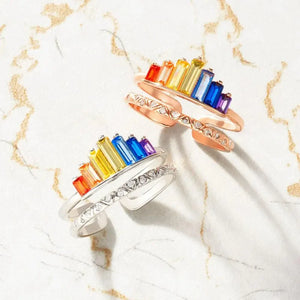 Rainbow prism stacked sterling rings in silver and rose gold with baguette gemstones and diamond accents.