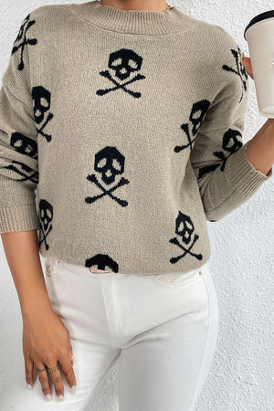 Khaki knit mock neck sweater with allover black skull and crossbones motif.