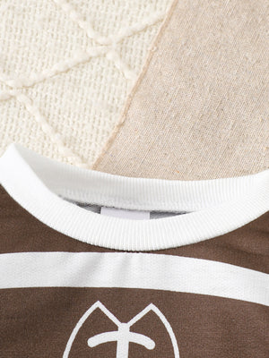 Brown and white striped baby top with football graphic and white ribbed neckline.