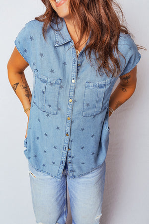 Light blue denim shirt with all-over dark stars, button front, short sleeves, and two chest pockets.