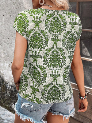 Light Green damask print blouse with short sleeves and a keyhole neckline.