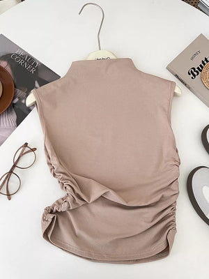 Apricot textured ruching mock neck tank top with draped sides.