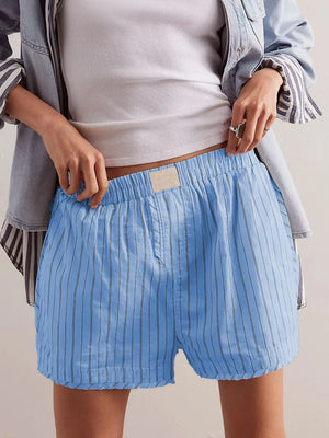 Light blue pinstripe boxer shorts with elastic waistband and button fly.