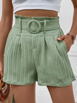 Light green pleated high-waist belted bermuda shorts with a ring buckle and vertical stripe texture.