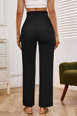 Black high-waisted flare leg trousers with a V-shaped seam detail at the back.