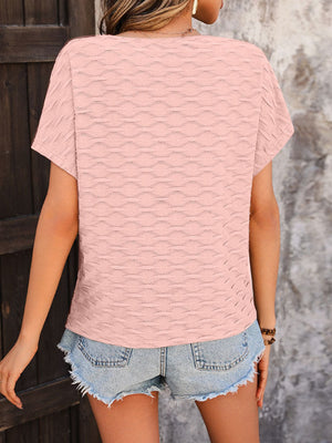 Watermelon pink textured wave-patterned cap-sleeve blouse with a relaxed fit.