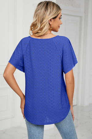 Blue eyelet tie-neck flutter sleeve blouse with a rounded hem.