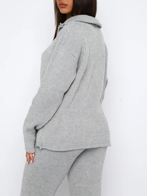 Gray ribbed knit quarter-zip lounge set with relaxed fit pants and top.