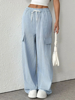 Light blue pleated cargo palazzo trousers with drawstring waist and side pockets.